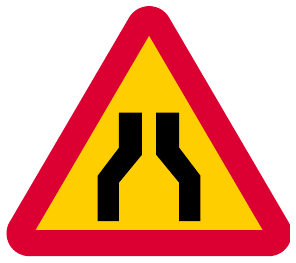 Road narrows from both sides